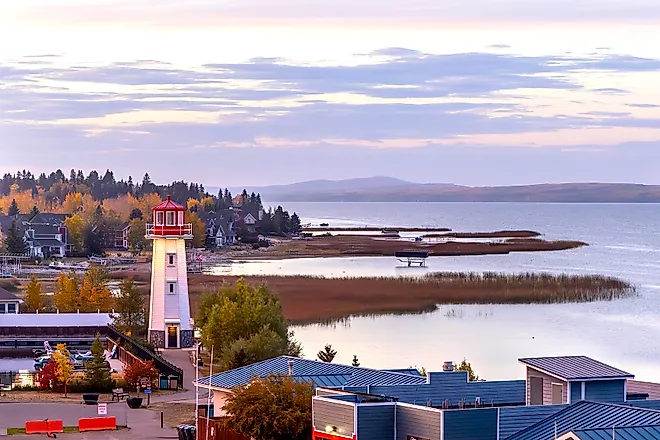 Lighthouse and shoreline at sunset in Sylvan Lake, Alberta, Canada.
