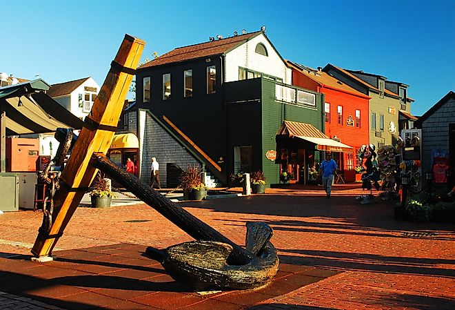 A historic anchor is a centerpiece of Bowens' Wharf, a shopping and dining district in Newport, Rhode Island. Image credit James Kirkikis via Shutterstock