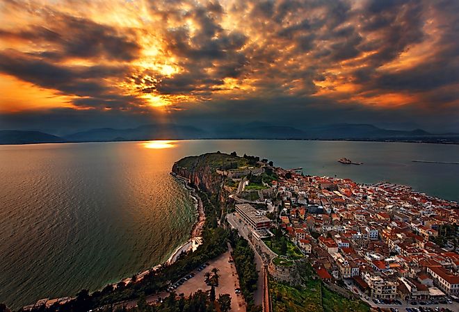 Panoramic view of Nafplio town and the Argolic gulf around sunset. Image credit Heracles Kritikos via Shutterstock. 