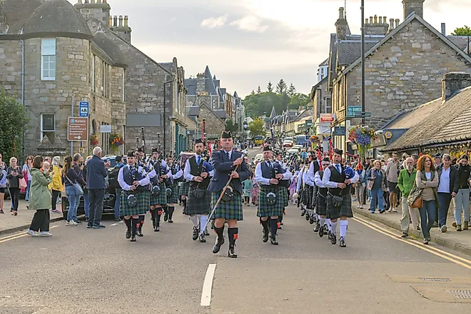 Pipe Band marching down Pitlochry High Street for the Highland Night. Image credit: Alan M. Walker / Shutterstock.com
