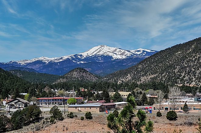 A panoramic view captures the snow-capped peak of Sierra Blanca, as seen from Ruidoso, New Mexico.