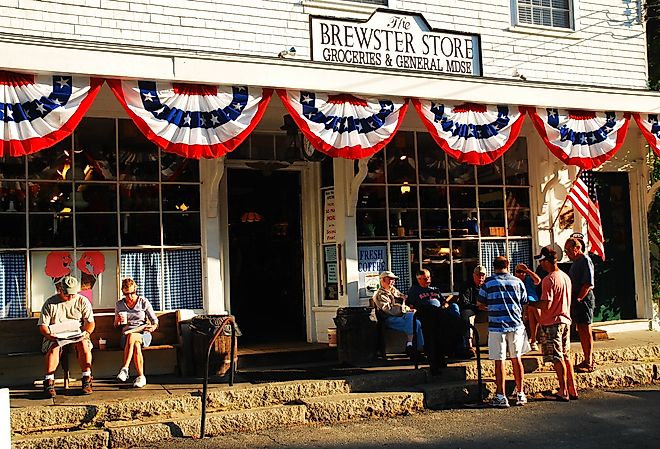 Neighbors catching up outside The Brewster Store on Cape Cod, Massachusetts. Editorial credit: James Kirkikis / Shutterstock.com