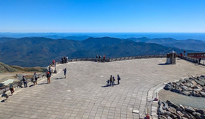  Tourists standing on the observation deck at the summit of Mount Washington. Editorial credit: travelview / Shutterstock.com