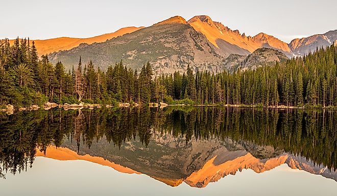 Sunset lake reflection of mountains at Bear Lake in Rocky Mountain National Park, Colorado.