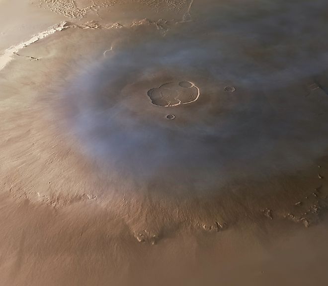 Olympus Mons volcano on Mars' surface. Editorial credit: Andera Luck, CC BY 2.0, via Wikimedia Commons