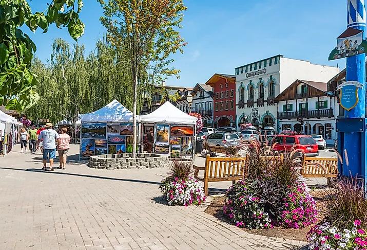 Main tourist street with art show and Bavarian style buildings in Leavenworth, Washington. Image credit Denise Lett via Shutterstock