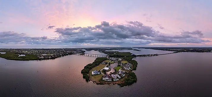 Panoramic aerial view of the Indian River Lagoon at sunrise with Wabasso Island and the Vero Beach coastline in Florida.