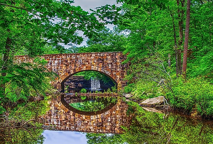 Foliage reflections of scenic Davies Bridge in Petit Jean State Park near Russellville, Arkansas.