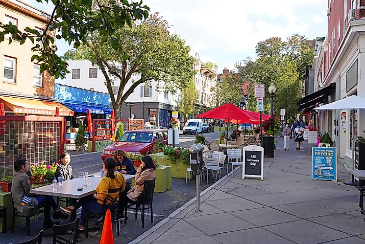 View of people eating on outdoor patios on Witherspoon Street in downtown Princeton, New Jersey. Editorial credit: EQRoy / Shutterstock.com