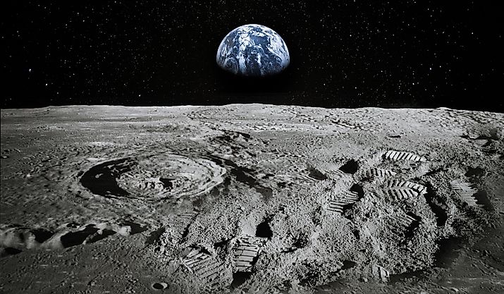View of Moon limb with Earth rising on the horizon. Footprints as an evidence of people being there or great forgery. Collage. Elements of this image furnished by NASA.