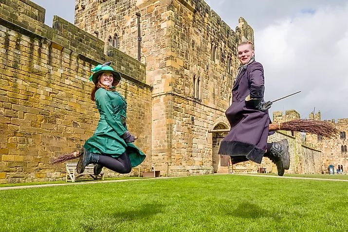 Two participants learn how to ride a broom and play quidditch at the Alnwick Castle. Credit: Bryan Dearsley