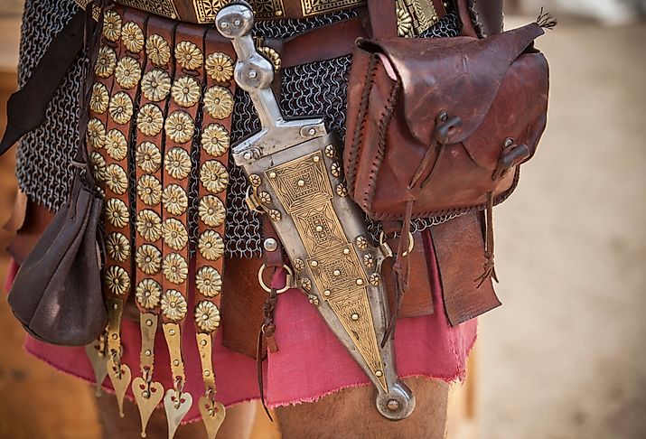 Historical reenactment of a Centurion girding a pugio, a dagger used by Roman soldiers as a sidearm.