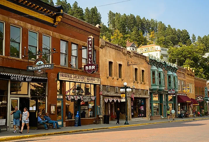 Historic saloons, bars, and shops in Deadwood, South Dakota, in the fall. Image credit Kenneth Sponsler via Shutterstock