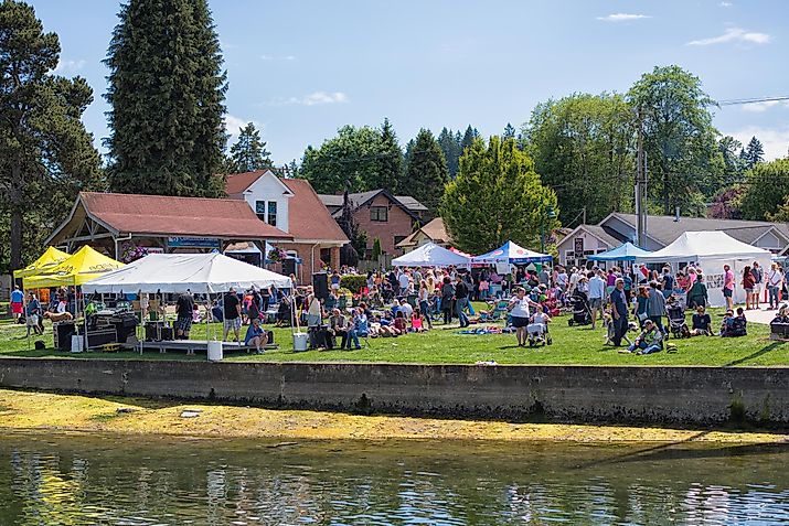 People enjoying the Maritime Gig Harbor Festival, via july7th / IStock.com
