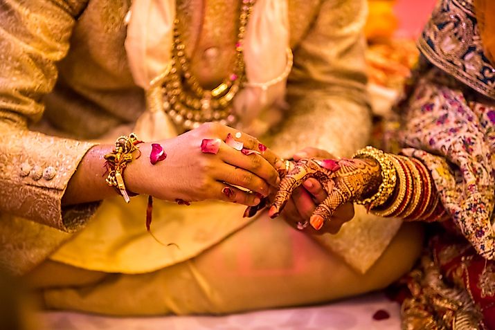 Indian wedding ceremony.hands of the bride held by a groom during a traditional ritual in an Indian Hindu Wedding