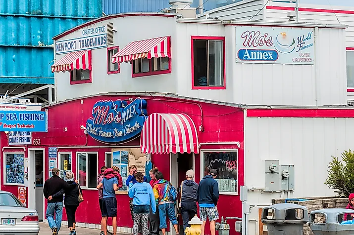 Dee Browning via Shutterstock. Newport, Oregon,USA: Tourist stand in front of Moe's seafood annex in downtown Newport.