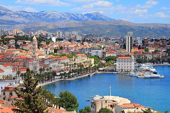 The stately Old Town facade of Split, Croatia, backdropped by the Dinaric Alps and met by the Adriatic Sea.