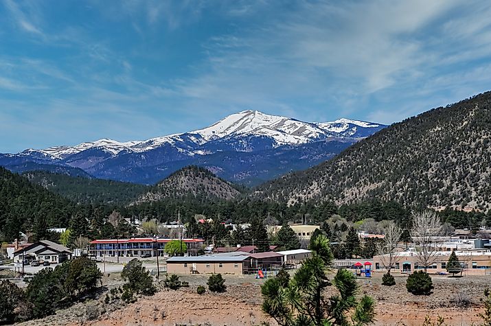 A panoramic view captures the snow-capped peak of Sierra Blanca, as seen from Ruidoso, New Mexico.