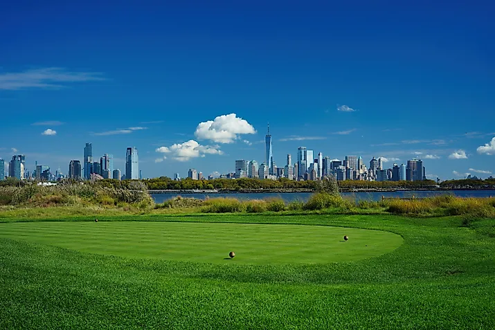 Golfer hit sweeping driver after hitting golf ball down the fairway. Editorial credit: Photoongraphy via Shutterstock.com.