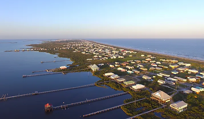 Stilt houses with long docks in the low-lying town of Grand Isle, Louisiana.