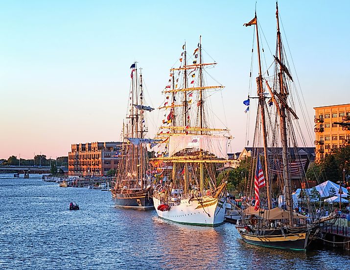 Bay City, Michigan: Tall Ships line the river's edge at Wenonah Park at sunset for the Tall Ship Celebration, via Editorial credit: Craig Sterken / Shutterstock.com
