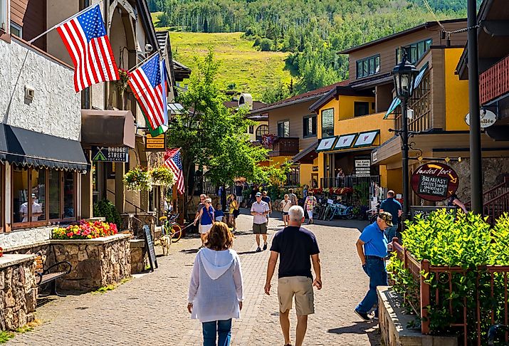 People walking in downtown Vail, Colorado in the summer. Image credit Alex Cimbal via Shutterstock