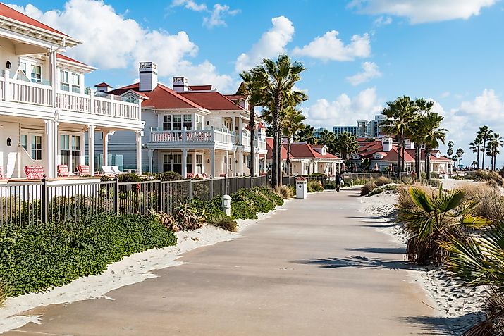 A sidewalk by beachfront cottages of the Hotel del Coronado