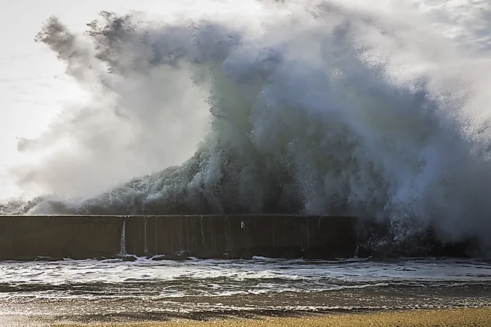 Huge wave by the ocean. 