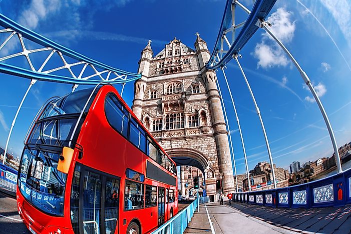 A tour bus passes over the River Thames on the famous Tower Bridge. A tour bus passes over the River Thames on the famous Tower Bridge.