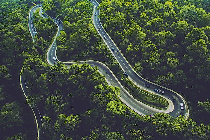 Winding road through Sumatra's luscious tropical forest.