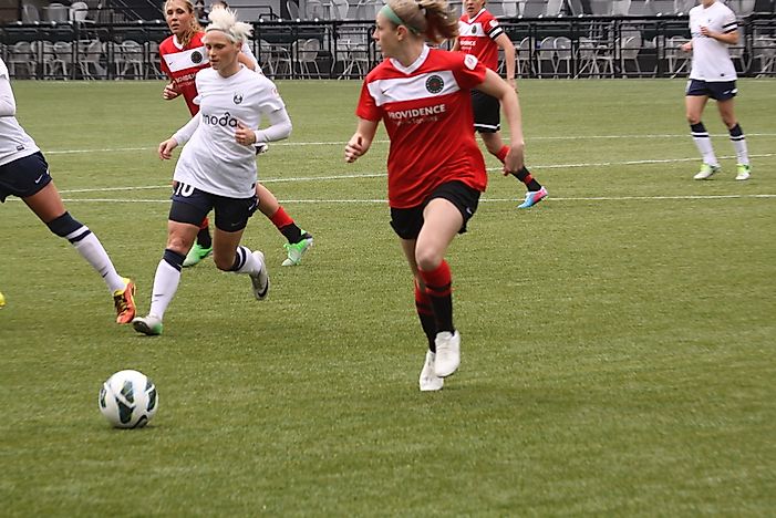 Seattle Reign players wear blue and white uniforms. Editorial credit: Keeton Gale / Shutterstock.com