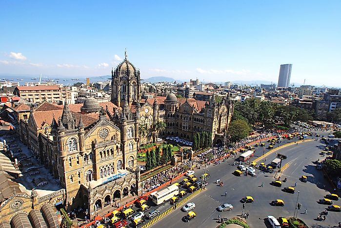 Passenger and vehicle traffic around the main train station in Mumbai. Passenger and vehicle traffic around the main train station in Mumbai.