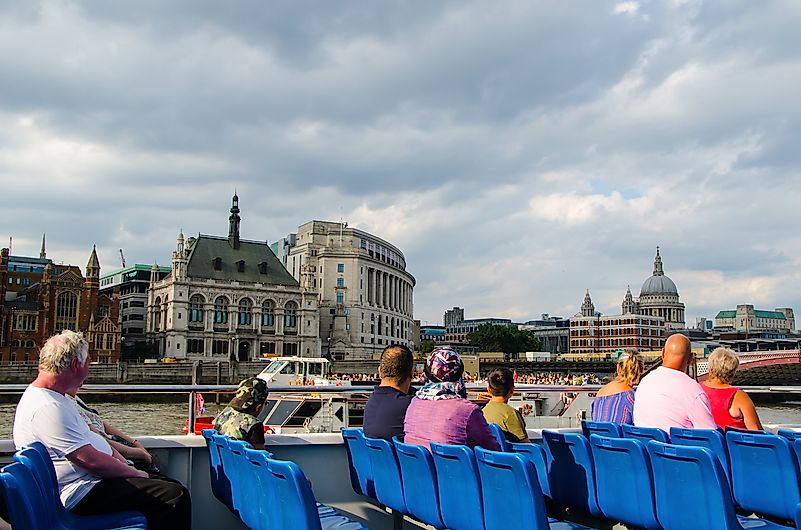Tourists cruising on the River Thames. Tourists cruising on the River Thames.