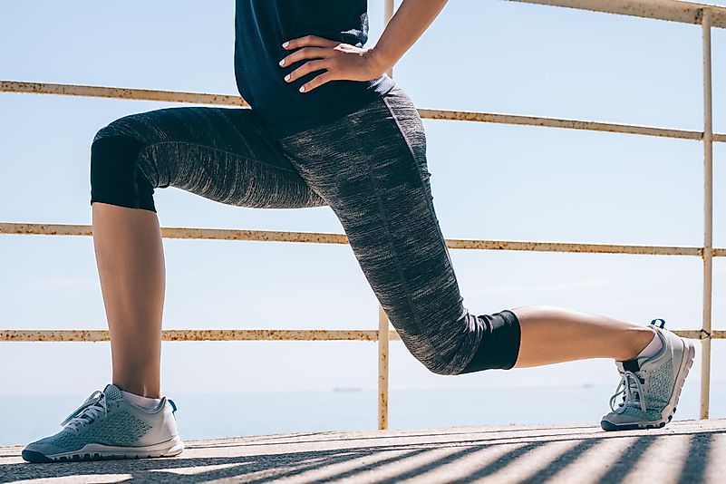 You can either put your hands on your hips or spread them wide, which will affect your balance. You can either put your hands on your hips or spread them wide, which will affect your balance.