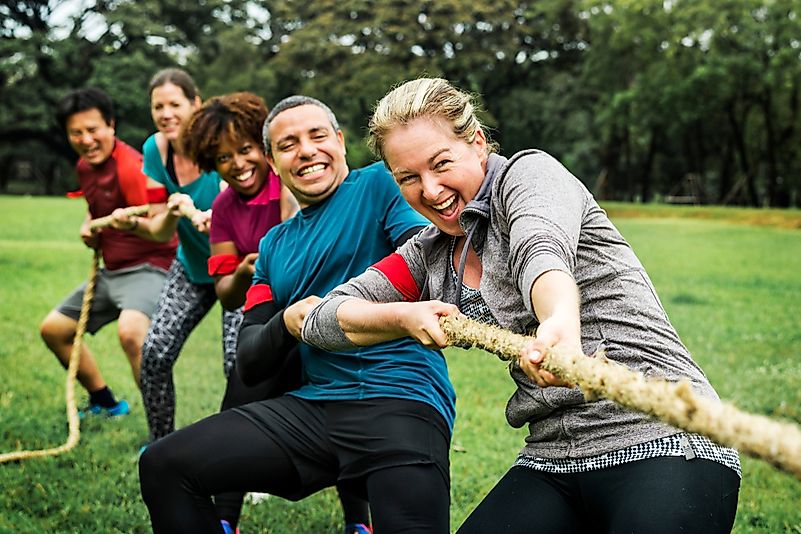 Team competing in tug of war. Team competing in tug of war.