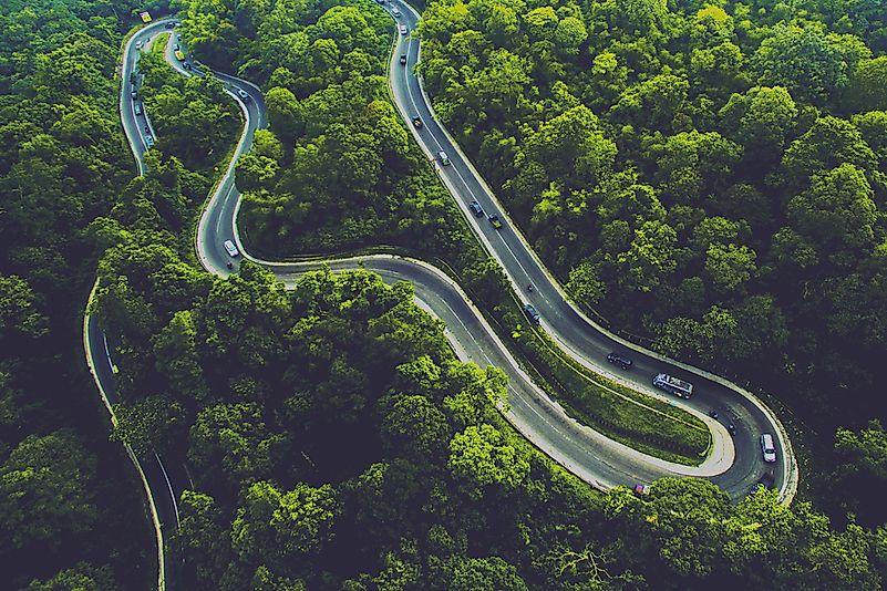 Winding road through Sumatra's luscious tropical forest.