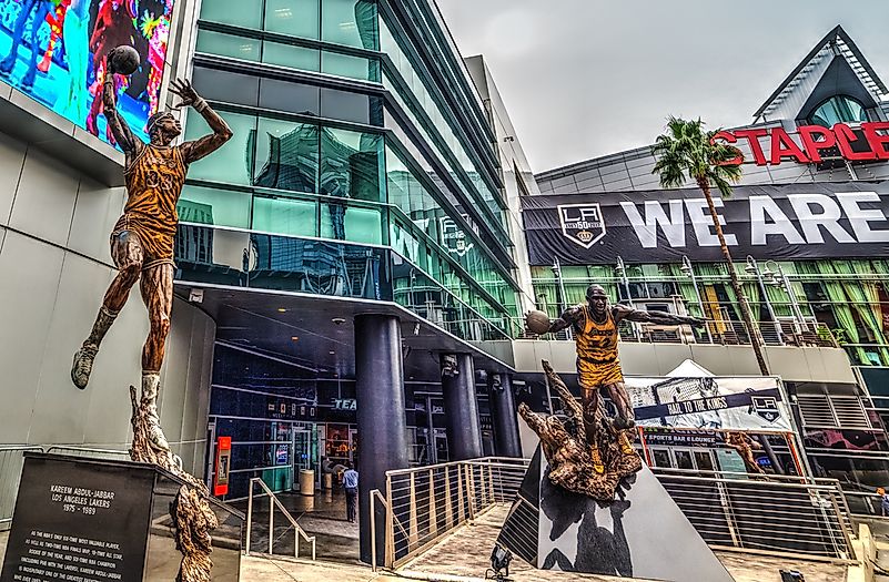 Statues of former Lakers and NBA legends Kareem Abdul-Jabbar and Magic Johnson outside the Staples Center. Editorial credit: Gabriele Maltinti / Shutterstock.com