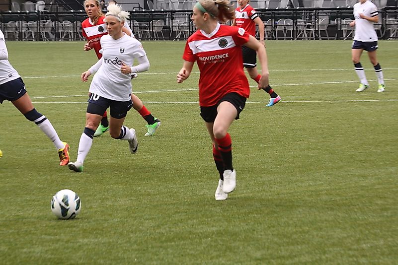 Seattle Reign players wear blue and white uniforms. Editorial credit: Keeton Gale / Shutterstock.com