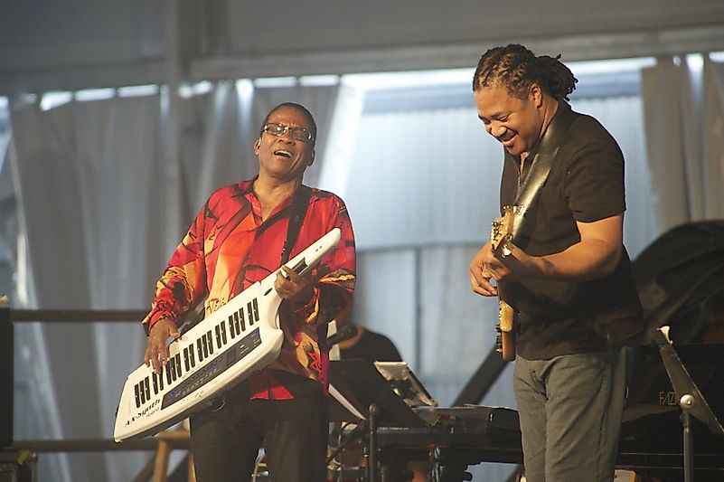 Herbie Hancock & West African Guitarist Lionel Loueke Jam at 2012 New Orleans Jazz & Heritage Festival. Image credit: Brian Ross / Shutterstock.com Herbie Hancock & West African Guitarist Lionel Loueke Jam at 2012 New Orleans Jazz & Heritage Festival. Image credit: Brian Ross / Shutterstock.com