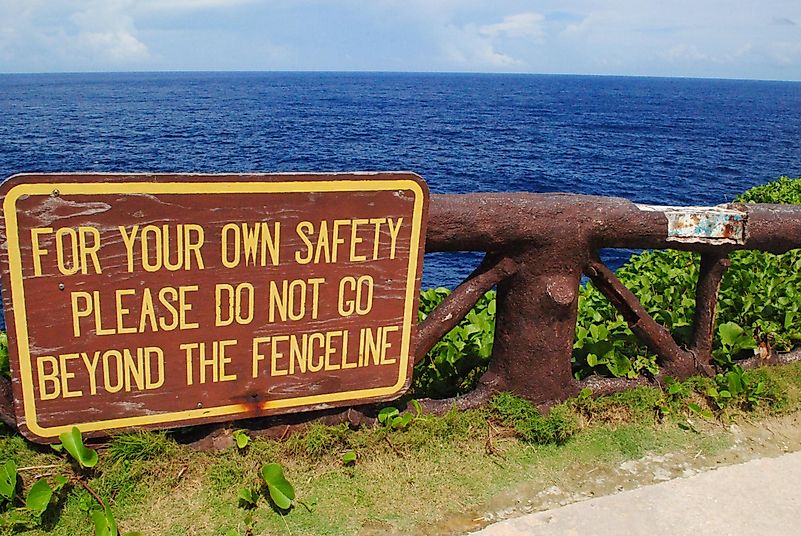 Sign on the railings at Banzai Cliff, a World War 11 historical site on Saipan, Northern Mariana Islands. Sign on the railings at Banzai Cliff, a World War 11 historical site on Saipan, Northern Mariana Islands.