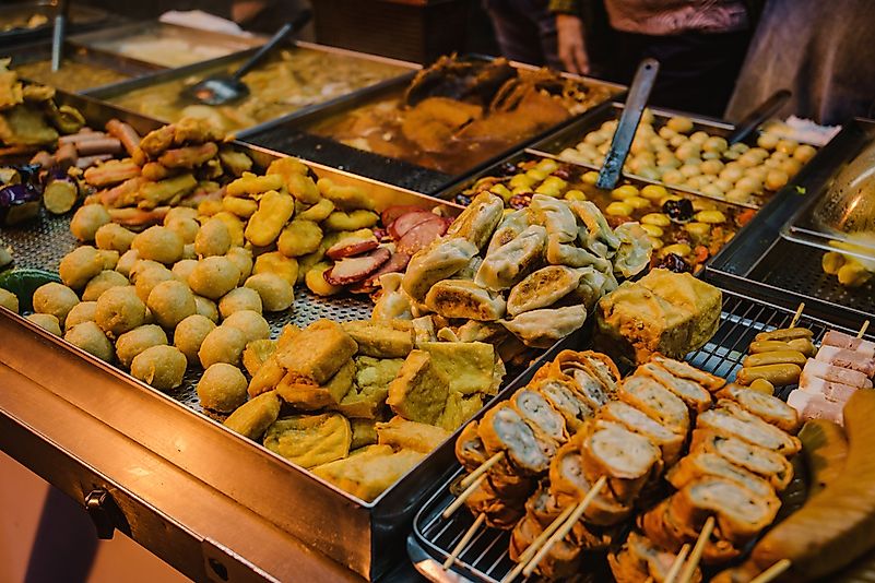 Street food offerings in a Hong Kong night market. Street food offerings in a Hong Kong night market.