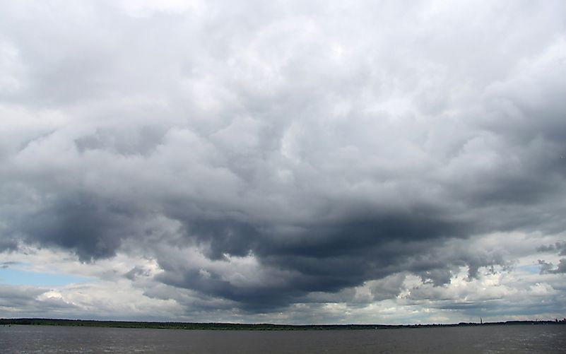 Nimbostratus clouds are dark at the bottom and light near the top. Nimbostratus clouds are dark at the bottom and light near the top.