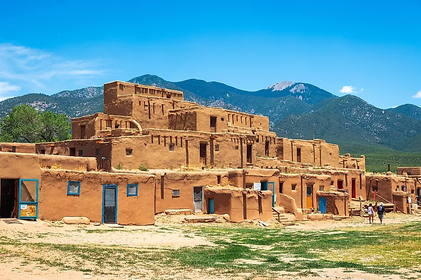Tourists visit the historic Taos Pueblo in Taos, New Mexico. Image