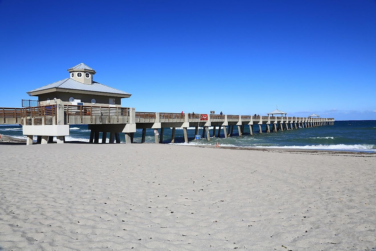 The Juno Beach fishing pier along the beach in Juno Beach, Florida.