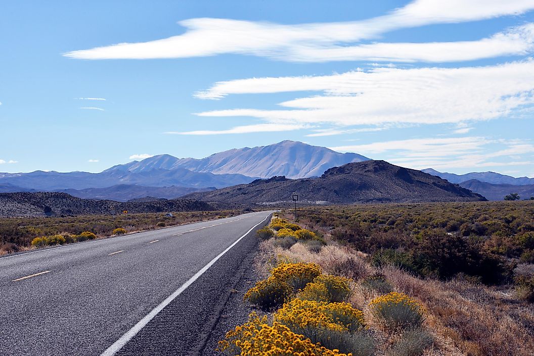 View of US Highway 50, also known as the Lincoln Highway or the Loneliest Road in America, winding through the scenic landscape of Austin, Nevada.