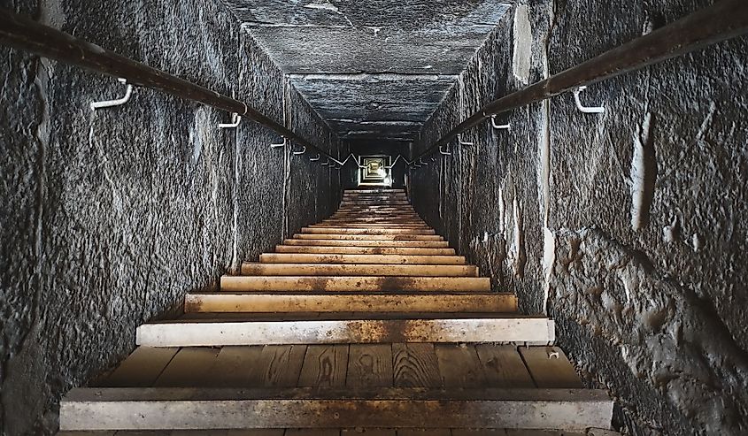 Descent into ancient Egyptian pyramid. Ancient catacombs.