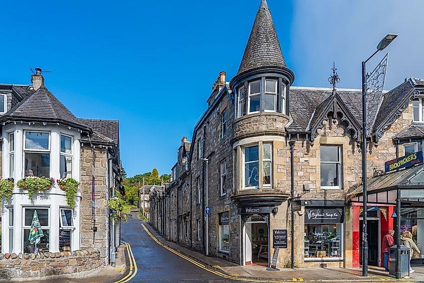 Street view from the main street Pitlochry in Scotland with shops in old historical buildings