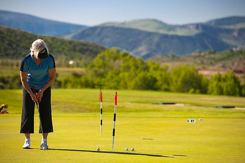 Woman golfing on the Aspen Golf Club