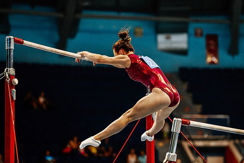 A gymnast performing on the balance beam.