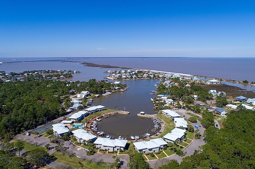 Small boat harbor at Dauphin Island, Alabama, under clear blue skies.